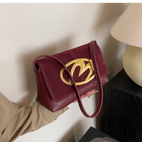 CREST SUEDE STATEMENT SHOULDER SLINGBAG