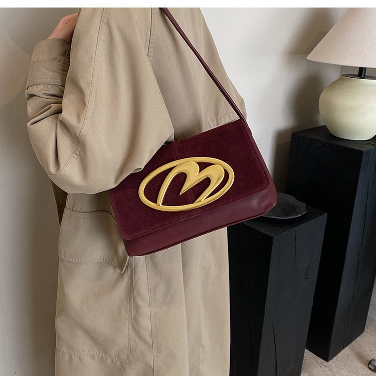 CREST SUEDE STATEMENT SHOULDER SLINGBAG