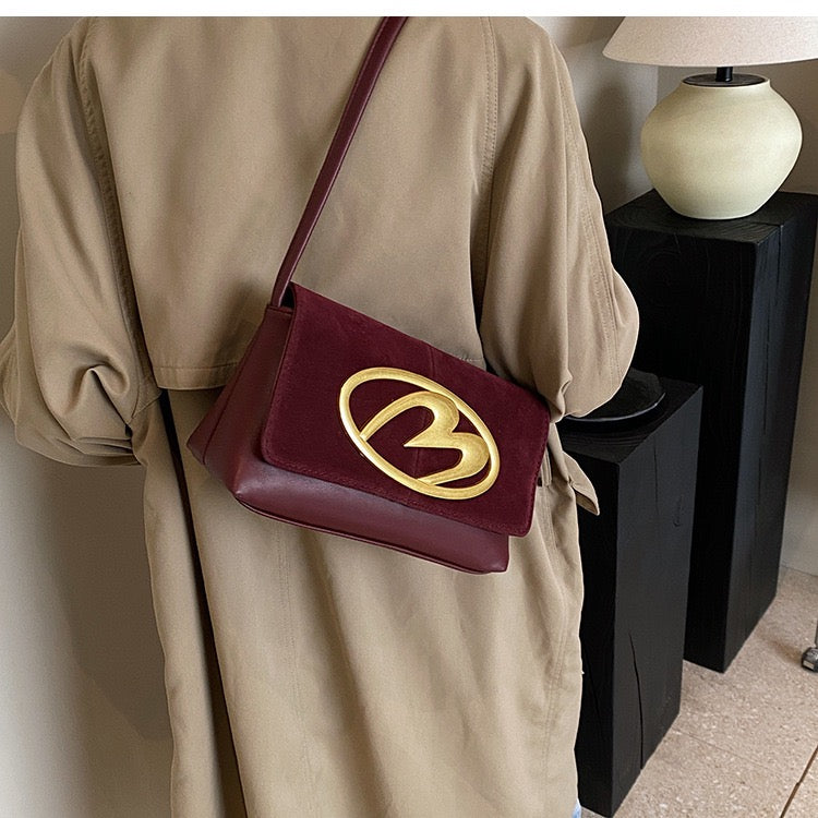 CREST SUEDE STATEMENT SHOULDER SLINGBAG