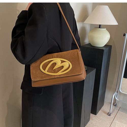 CREST SUEDE STATEMENT SHOULDER SLINGBAG